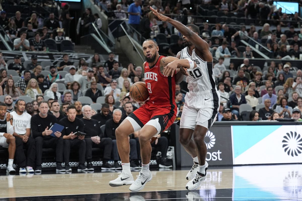 Oct 26, 2024; San Antonio, Texas, USA;  Houston Rockets forward Dillon Brooks (9) drives in against San Antonio Spurs forward Harrison Barnes (40) in the first half at Frost Bank Center. Mandatory Credit: Daniel Dunn-Imagn Images