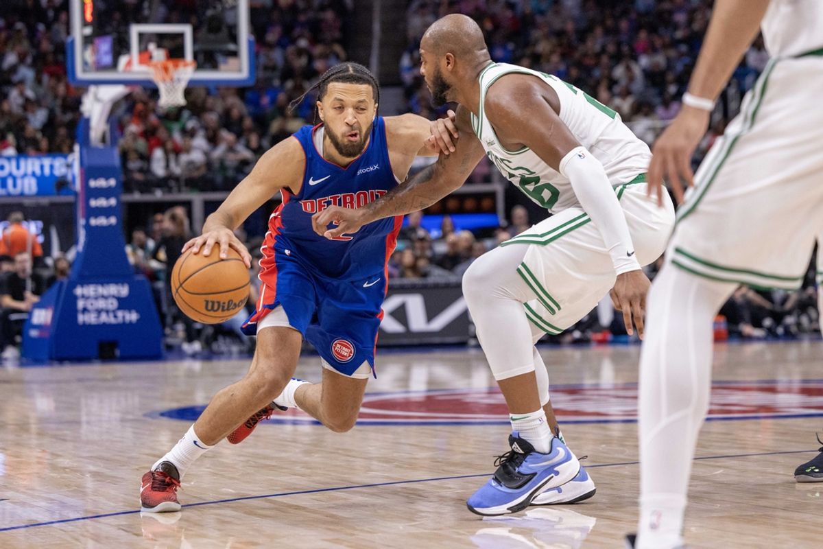 Oct 26, 2024; Detroit, Michigan, USA; Boston Celtics forward Xavier Tillman (26) defends against Detroit Pistons guard Cade Cunningham (2) during the second half at Little Caesars Arena. Mandatory Credit: David Reginek-Imagn Images