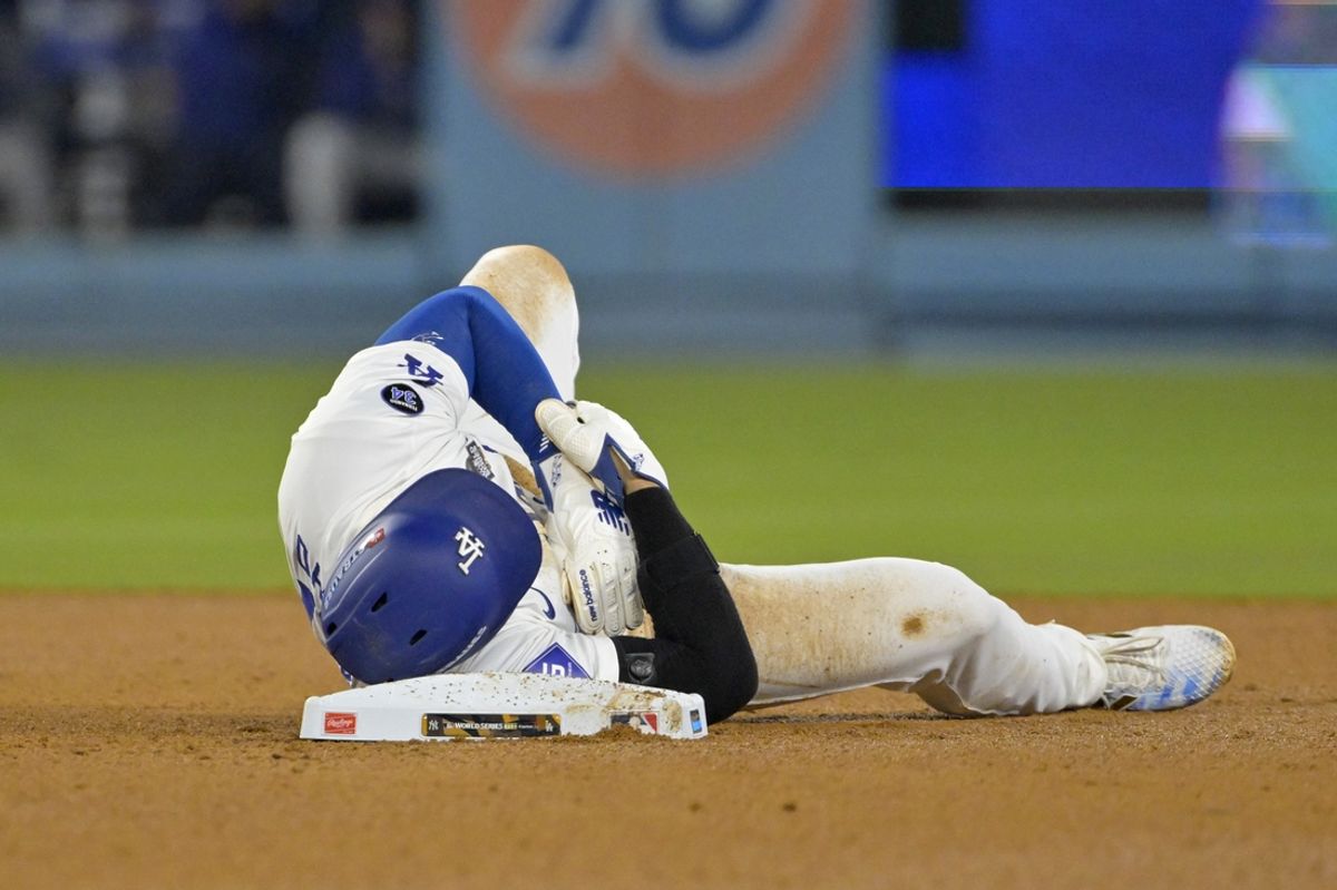 Oct 26, 2024; Los Angeles, California, USA; Los Angeles Dodgers designated hitter Shohei Ohtani (17) reacts at second base after an apparent injury in the seventh inning against the New York Yankees during game two of the 2024 MLB World Series at Dodger Stadium. Mandatory Credit: Jayne Kamin-Oncea-Imagn Images