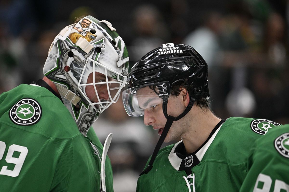Oct 26, 2024; Dallas, Texas, USA; Dallas Stars goaltender Jake Oettinger (29) and center Wyatt Johnston (53) celebrate on the ice after the Stars defeat the Chicago Blackhawks at the American Airlines Center. Mandatory Credit: Jerome Miron-Imagn Images