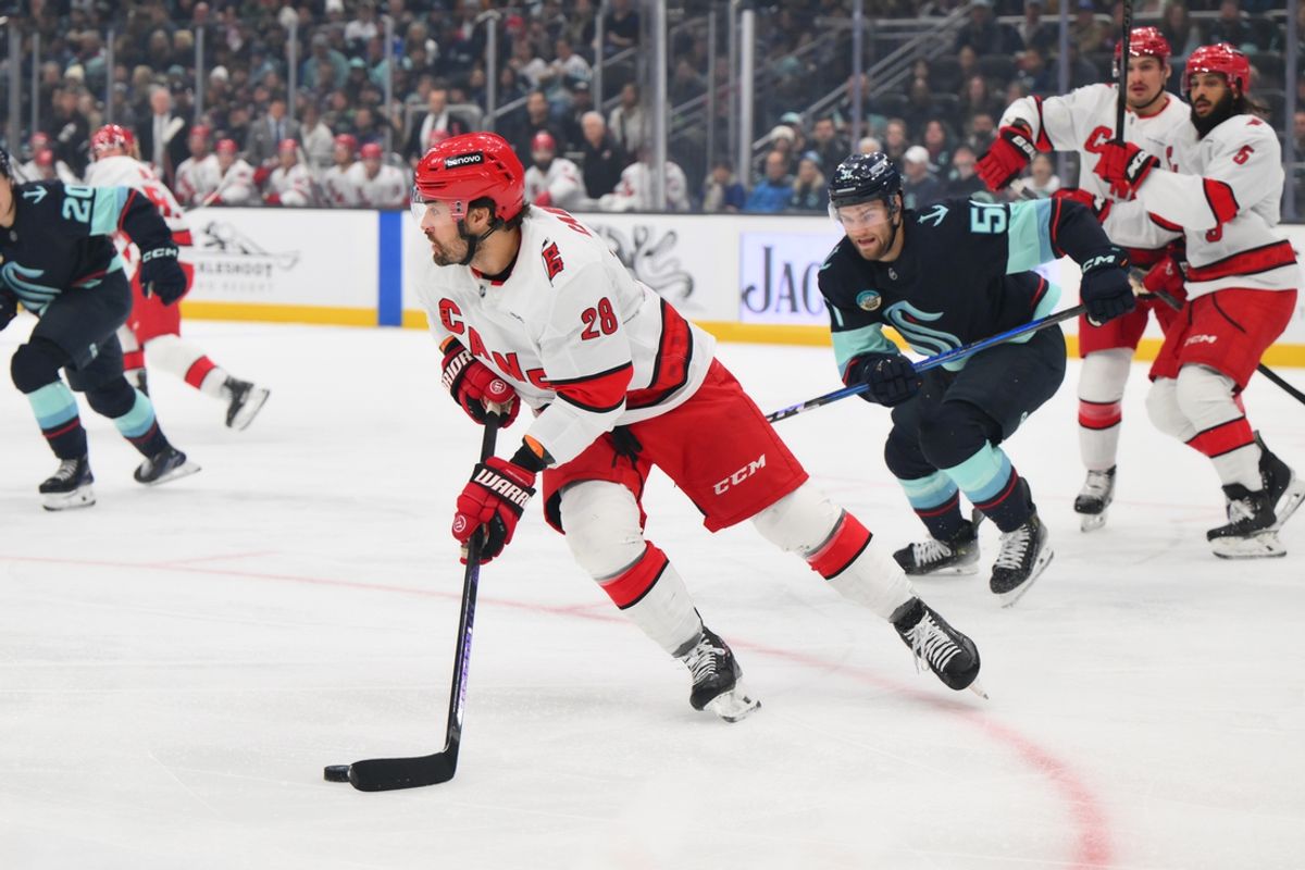 Oct 26, 2024; Seattle, Washington, USA; Carolina Hurricanes left wing William Carrier (28) plays the puck during the first period against the Seattle Kraken at Climate Pledge Arena. Mandatory Credit: Steven Bisig-Imagn Images