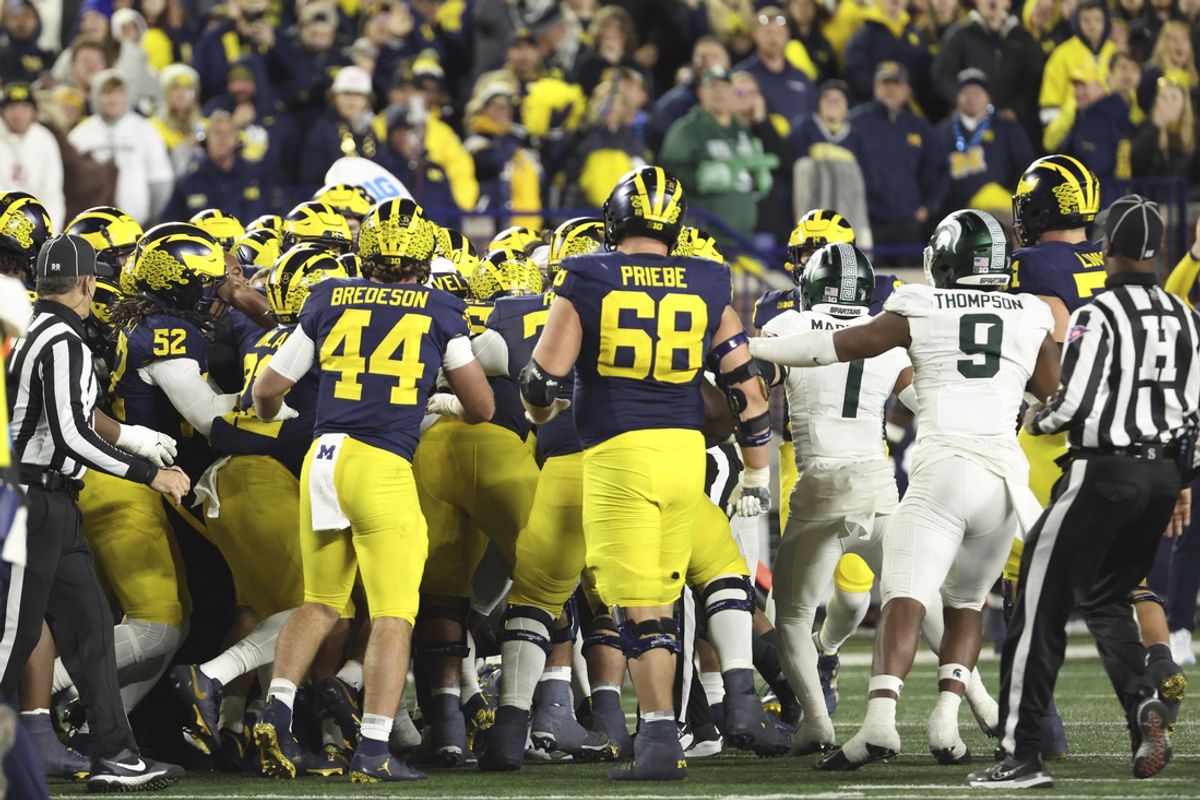Oct 26, 2024; Ann Arbor, Michigan, USA;  Michigan Wolverines and Michigan State Spartans players fight after the game at Michigan Stadium. Mandatory Credit: Rick Osentoski-Imagn Images