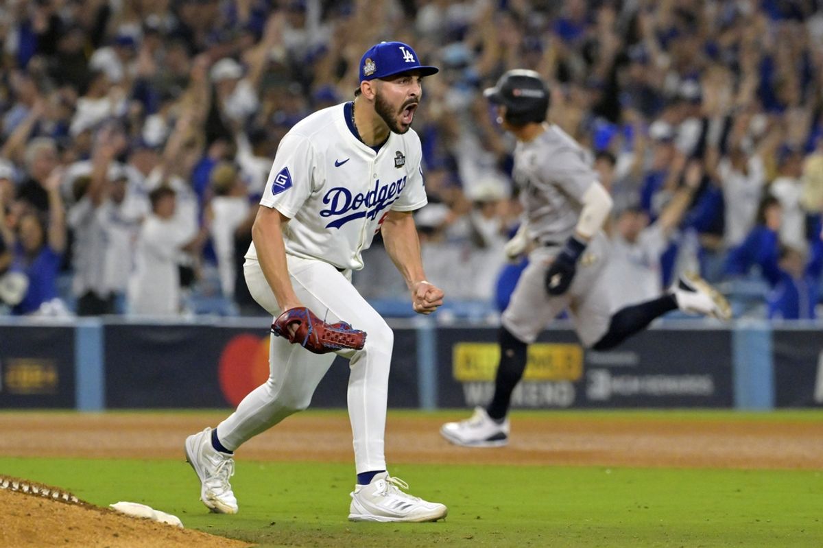 Oct 26, 2024; Los Angeles, California, USA; Los Angeles Dodgers pitcher Alex Vesia (51) reacts in the ninth inning against the New York Yankees during game two of the 2024 MLB World Series at Dodger Stadium. Mandatory Credit: Jayne Kamin-Oncea-Imagn Images