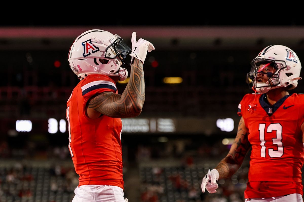 Oct 26, 2024; Tucson, Arizona, USA; Arizona Wildcats wide receiver Tetairoa McMillan (4) celebrates touchdown during the fourth quarter against the West Virginia Mountaineers at Arizona Stadium. Mandatory Credit: Aryanna Frank-Imagn Images