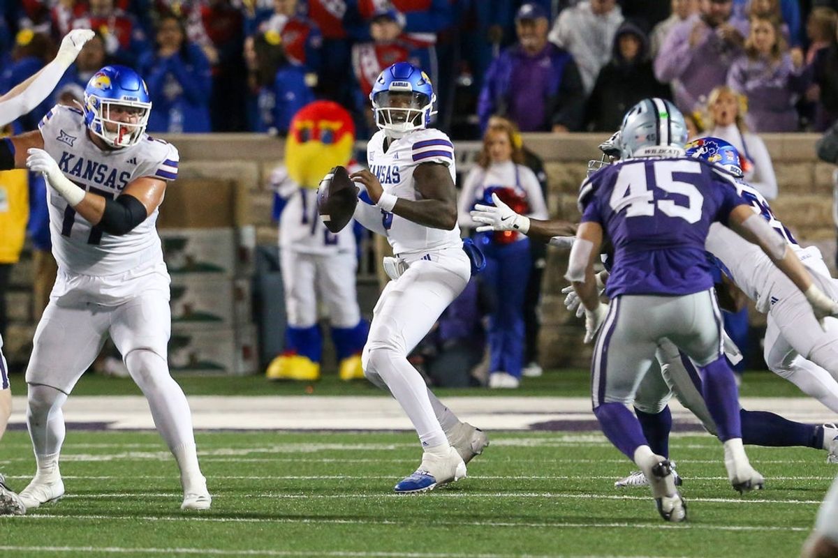 Oct 26, 2024; Manhattan, Kansas, USA; Kansas Jayhawks quarterback Jalon Daniels (6) drops back to pass during the fourth quarter against the Kansas State Wildcats at Bill Snyder Family Football Stadium. Mandatory Credit: Scott Sewell-Imagn Images