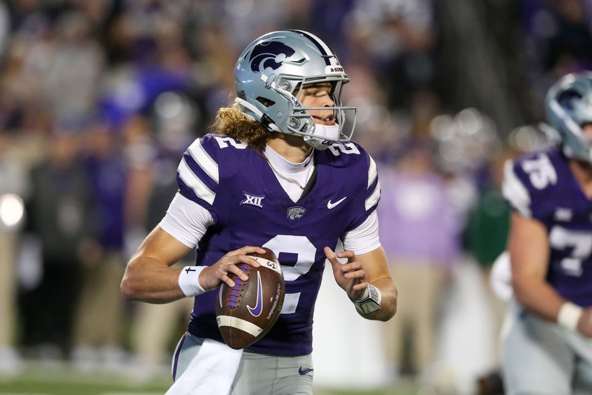 Oct 26, 2024; Manhattan, Kansas, USA; Kansas State Wildcats quarterback Avery Johnson (2) drops back to pass during the third quarter against the Kansas Jayhawks at Bill Snyder Family Football Stadium. Mandatory Credit: Scott Sewell-Imagn Images
