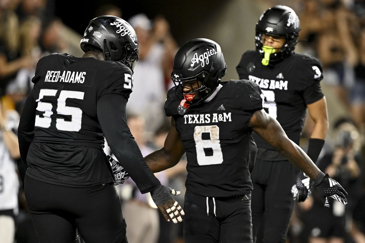 Oct 26, 2024; College Station, Texas, USA; Texas A&M Aggies running back Le'Veon Moss (8) reacts after scoring a touchdown against the LSU Tigers in the fourth quarter at Kyle Field. Mandatory Credit: Maria Lysaker-Imagn Images.