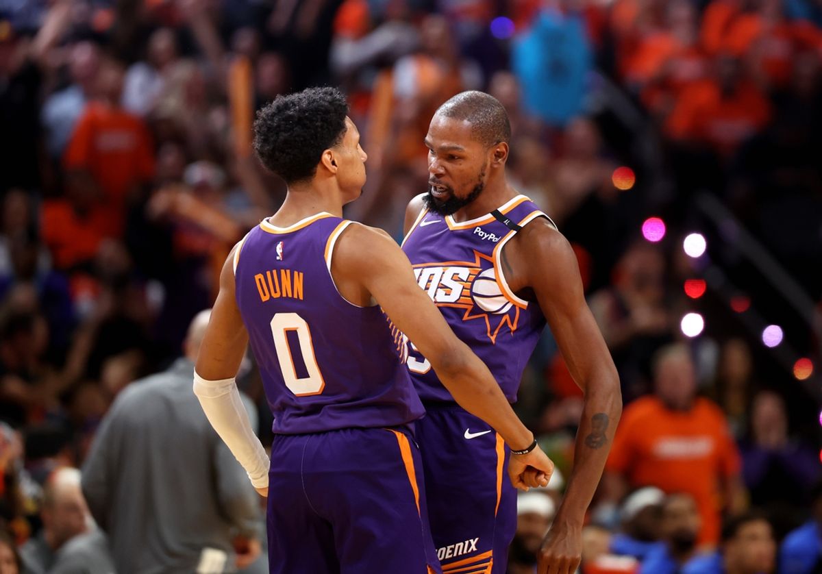 Oct 26, 2024; Phoenix, Arizona, USA; Phoenix Suns forward Kevin Durant (35) celebrates with forward Ryan Dunn (0) against the Dallas Mavericks in the second half of the home opener at Footprint Center. Mandatory Credit: Mark J. Rebilas-Imagn Images