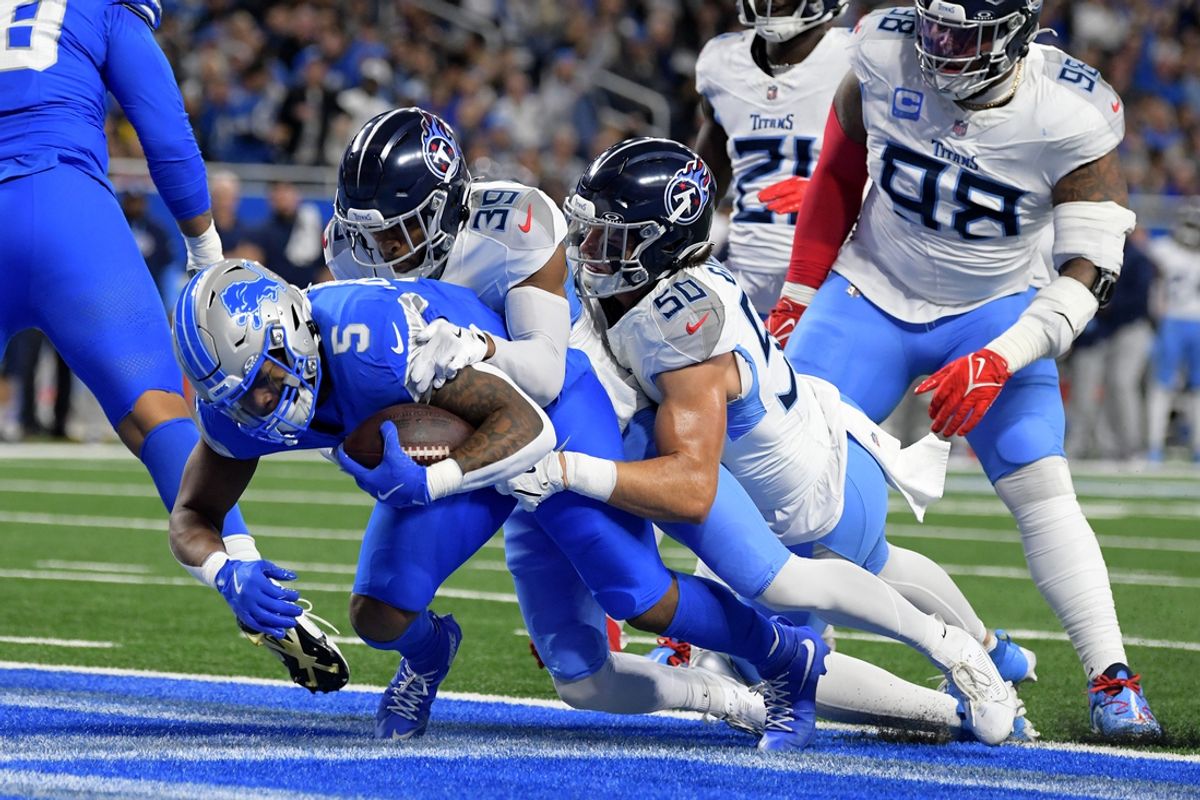 Oct 27, 2024; Detroit, Michigan, USA;  Detroit Lions running back David Montgomery (5) scores a touchdown against the Tennessee Titans in the first quarter at Ford Field. Mandatory Credit: Lon Horwedel-Imagn Images