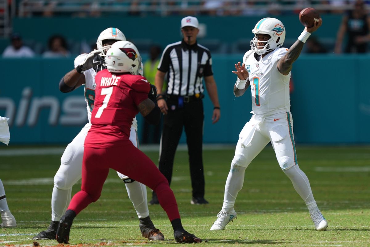 Oct 27, 2024; Miami Gardens, Florida, USA;  Miami Dolphins quarterback Tua Tagovailoa (1) drops back to pass against the Arizona Cardinals in the first quarter at Hard Rock Stadium. Mandatory Credit: Jim Rassol-Imagn Images