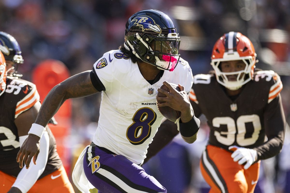 Oct 27, 2024; Cleveland, Ohio, USA; Baltimore Ravens quarterback Lamar Jackson (8) runs the ball against the Cleveland Browns during the second quarter at Huntington Bank Field. Mandatory Credit: Scott Galvin-Imagn Images