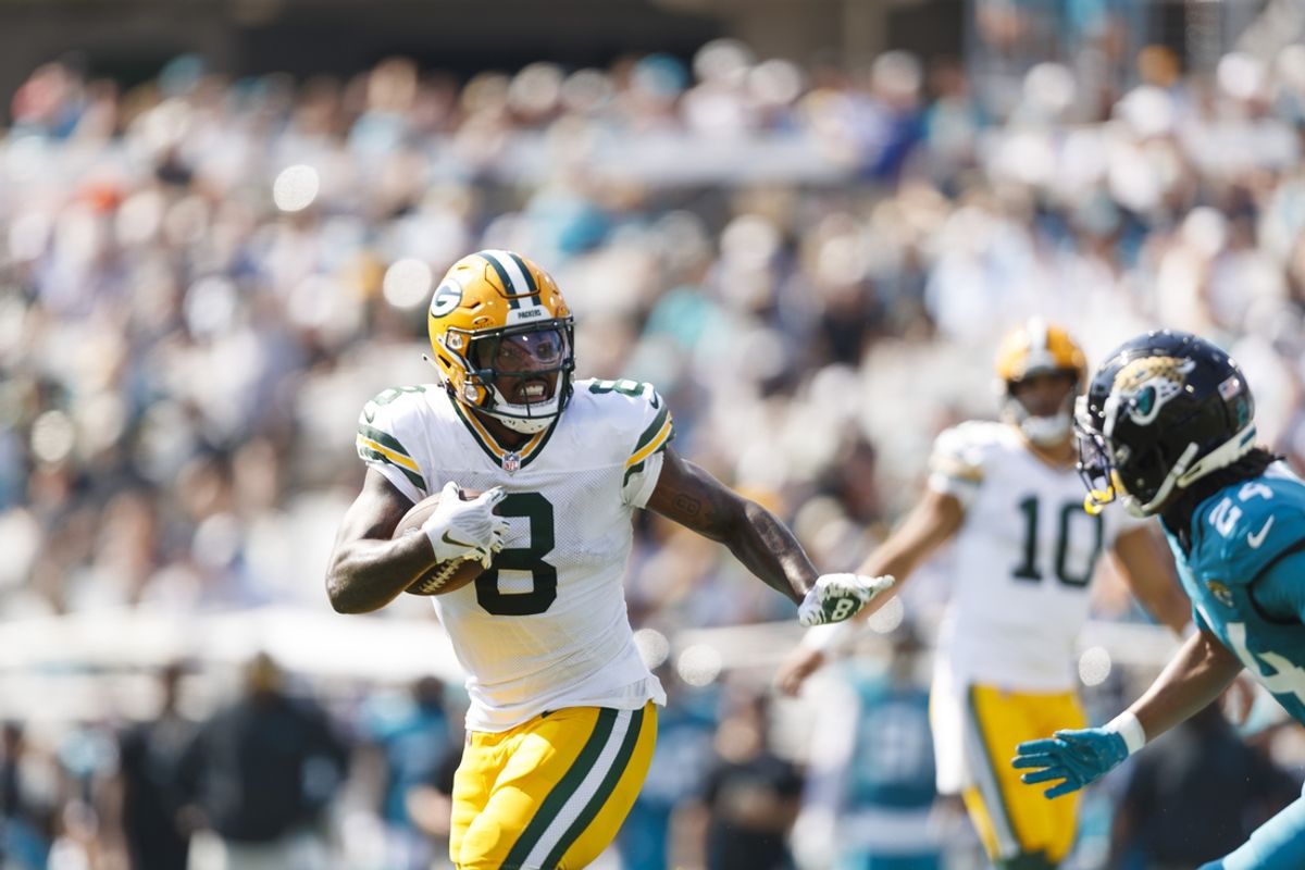 Oct 27, 2024; Jacksonville, Florida, USA; Green Bay Packers running back Josh Jacobs (8) runs the ball against the Jacksonville Jaguars during the second quarter at EverBank Stadium. Mandatory Credit: Morgan Tencza-Imagn Images