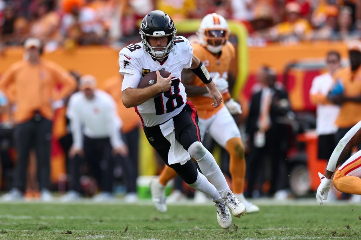 Oct 27, 2024; Tampa, Florida, USA; Atlanta Falcons quarterback Kirk Cousins (18) runs with the ball against the Tampa Bay Buccaneers in the fourth quarter at Raymond James Stadium. Mandatory Credit: Nathan Ray Seebeck-Imagn Images