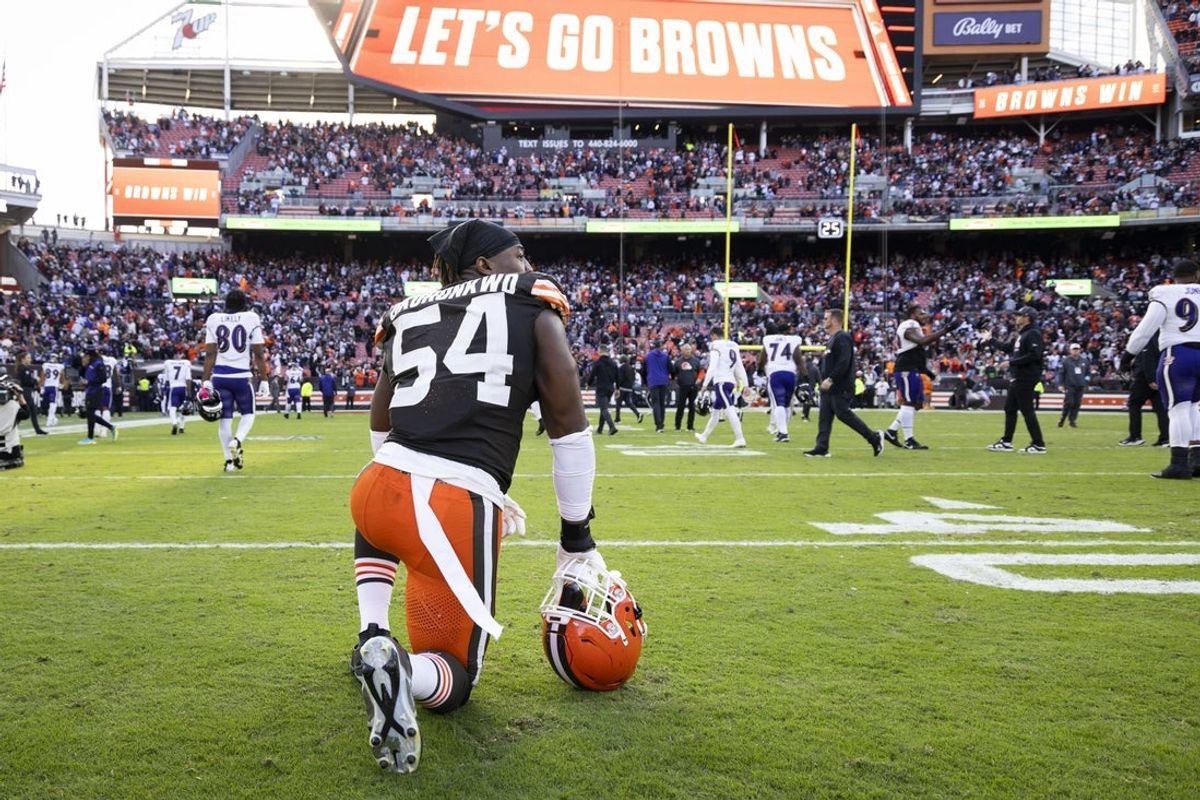 Oct 27, 2024; Cleveland, Ohio, USA; Cleveland Browns defensive end Ogbo Okoronkwo (54) kneels on the field after defeating the Baltimore Ravens at Huntington Bank Field. Mandatory Credit: Scott Galvin-Imagn Images