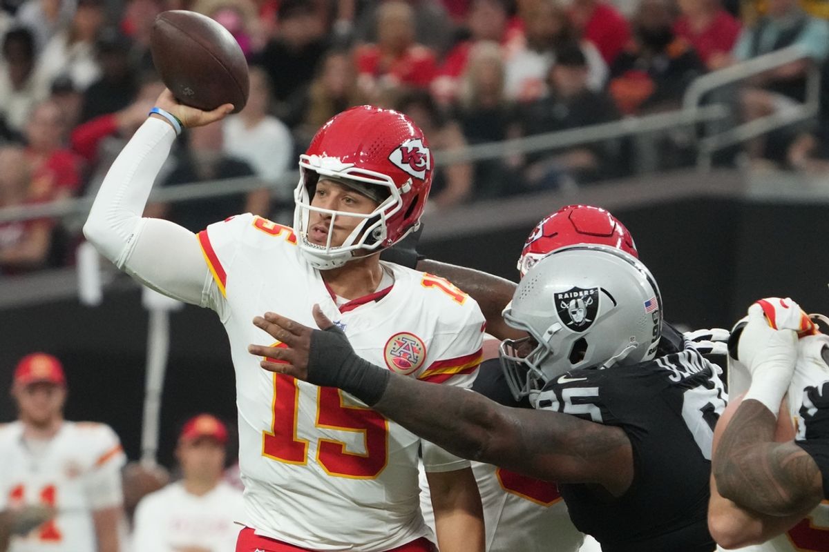 Oct 27, 2024; Paradise, Nevada, USA; Kansas City Chiefs quarterback Patrick Mahomes (15) throws the ball against pressure from Las Vegas Raiders defensive tackle John Jenkins (95) in the first half at Allegiant Stadium. Mandatory Credit: Kirby Lee-Imagn Images
