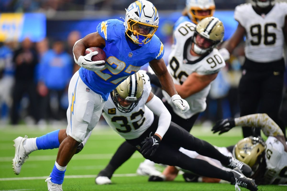 Oct 27, 2024; Inglewood, California, USA; Los Angeles Chargers running back J.K. Dobbins (27) runs the ball for a touchdown against the New Orleans Saints during the first half at SoFi Stadium. Mandatory Credit: Gary A. Vasquez-Imagn Images
