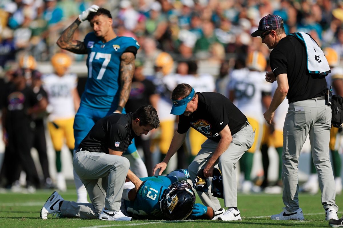 Jacksonville Jaguars wide receiver Christian Kirk (13) lies on the turf after sustaining an unknown injury as tight end Evan Engram (17) reacts during the fourth quarter of an NFL football matchup Sunday, Oct. 27, 2024 at EverBank Stadium in Jacksonville, Fla. The Packers edged the Jaguars 30-27 on a last-second field goal. [Corey Perrine/Florida Times-Union]