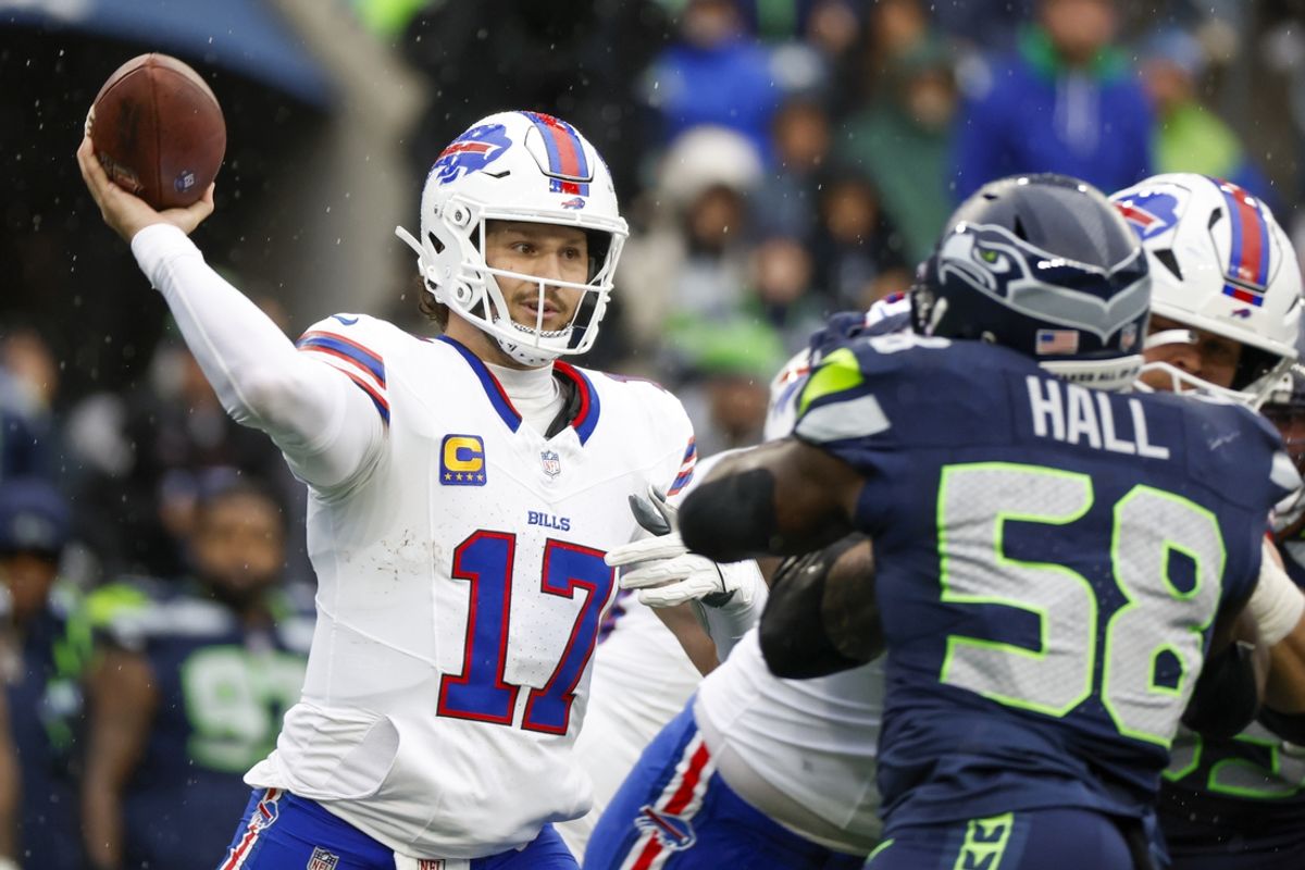 Oct 27, 2024; Seattle, Washington, USA; Buffalo Bills quarterback Josh Allen (17) passes against the Seattle Seahawks during the second quarter at Lumen Field. Mandatory Credit: Joe Nicholson-Imagn Images