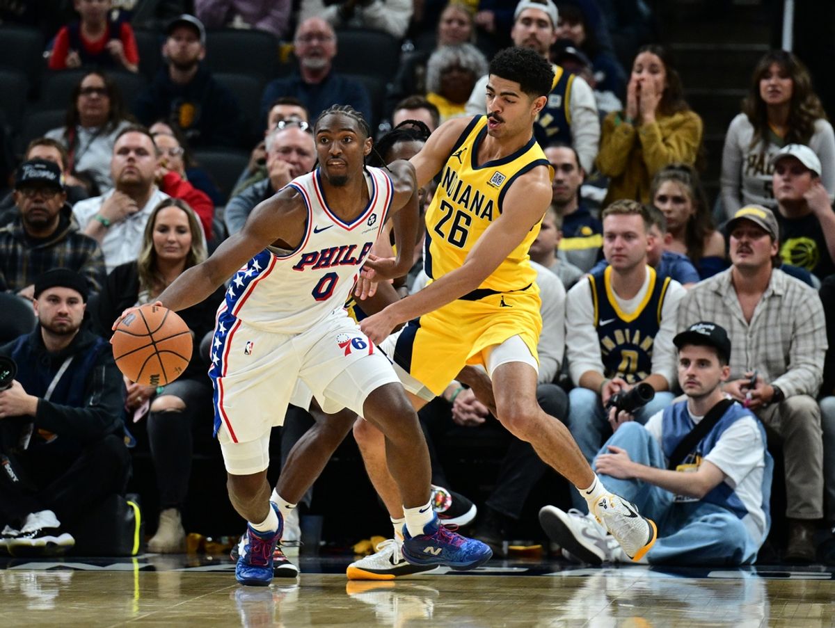 Oct 27, 2024; Indianapolis, Indiana, USA; Philadelphia 76ers guard Tyrese Maxey (0) drives past Indiana Pacers guard Ben Sheppard (26) during overtime at Gainbridge Fieldhouse. Mandatory Credit: Marc Lebryk-Imagn Images