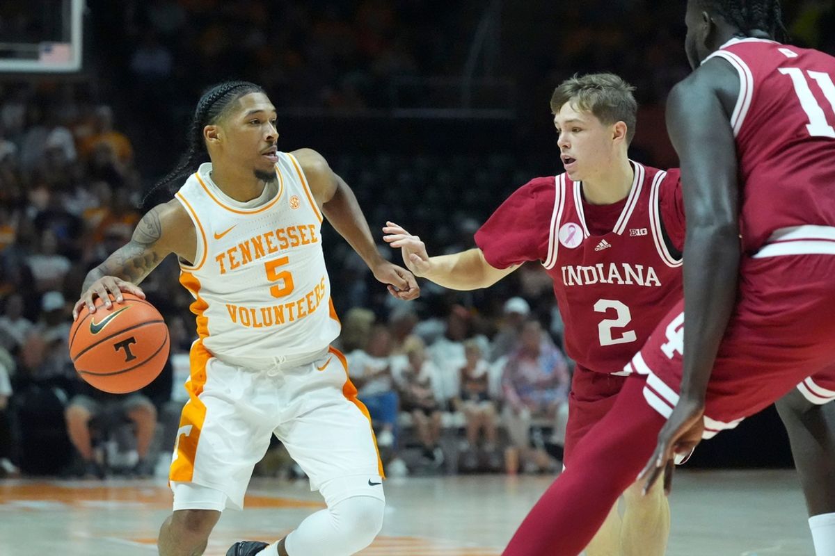 Tennessee guard Zakai Zeigler (5) is guarded by Indiana guard Gabe Cupps (2) and center Oumar Ballo (11) during a college basketball exhibition game on Sunday, October 27, 2024, in Knoxville. Tenn.
