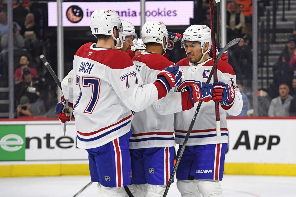 Oct 27, 2024; Philadelphia, Pennsylvania, USA; Montreal Canadiens center Nick Suzuki (14) celebrates his goal  with teammates against Philadelphia Flyers during the first period at Wells Fargo Center. Mandatory Credit: Eric Hartline-Imagn Images