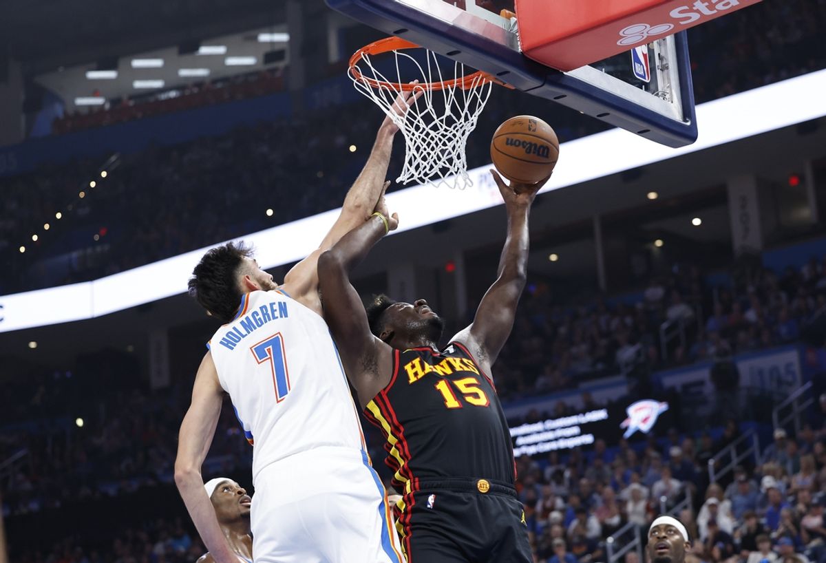 Oct 27, 2024; Oklahoma City, Oklahoma, USA; Atlanta Hawks center Clint Capela (15) shoots as Oklahoma City Thunder forward Chet Holmgren (7) defends during the second quarter at Paycom Center. Mandatory Credit: Alonzo Adams-Imagn Images