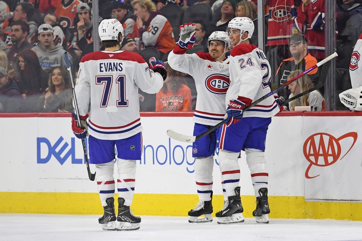 Oct 27, 2024; Philadelphia, Pennsylvania, USA; Montreal Canadiens right wing Brendan Gallagher (11) celebrates his goal with center Jake Evans (71) and defenseman Logan Mailloux (24) against the Philadelphia Flyers during the second period at Wells Fargo Center. Mandatory Credit: Eric Hartline-Imagn Images
