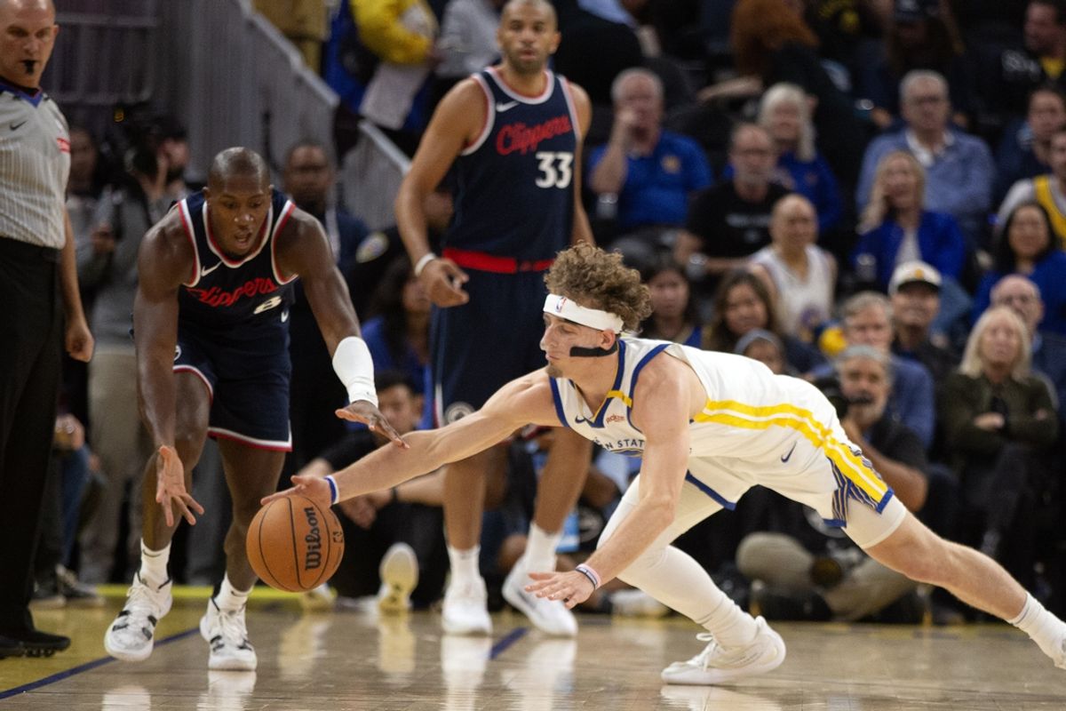 Oct 27, 2024; San Francisco, California, USA; Los Angeles Clippers guard Kris Dunn (left) and Golden State Warriors guard Brandin Podziemski (2) collide chasing a loose ball during the first quarter at Chase Center. Mandatory Credit: D. Ross Cameron-Imagn Images