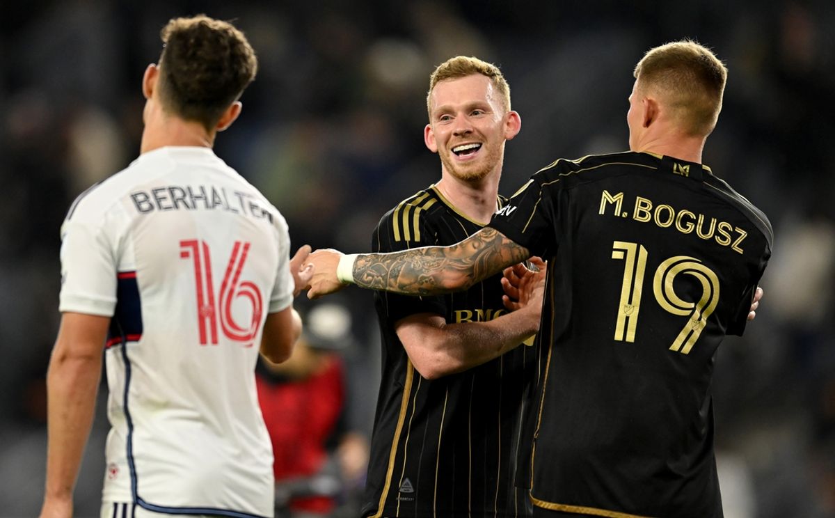 Oct 27, 2024; Los Angeles, California, USA; LAFC midfielder Lewis O'Brien (8) and midfielder Mateusz Bogusz (19) talk to Vancouver Whitecaps FC midfielder Sebastian Berhalter (16) during the second half in a 2024 MLS Cup Playoffs Round One match at BMO Stadium. Mandatory Credit: Jonathan Hui-Imagn Images