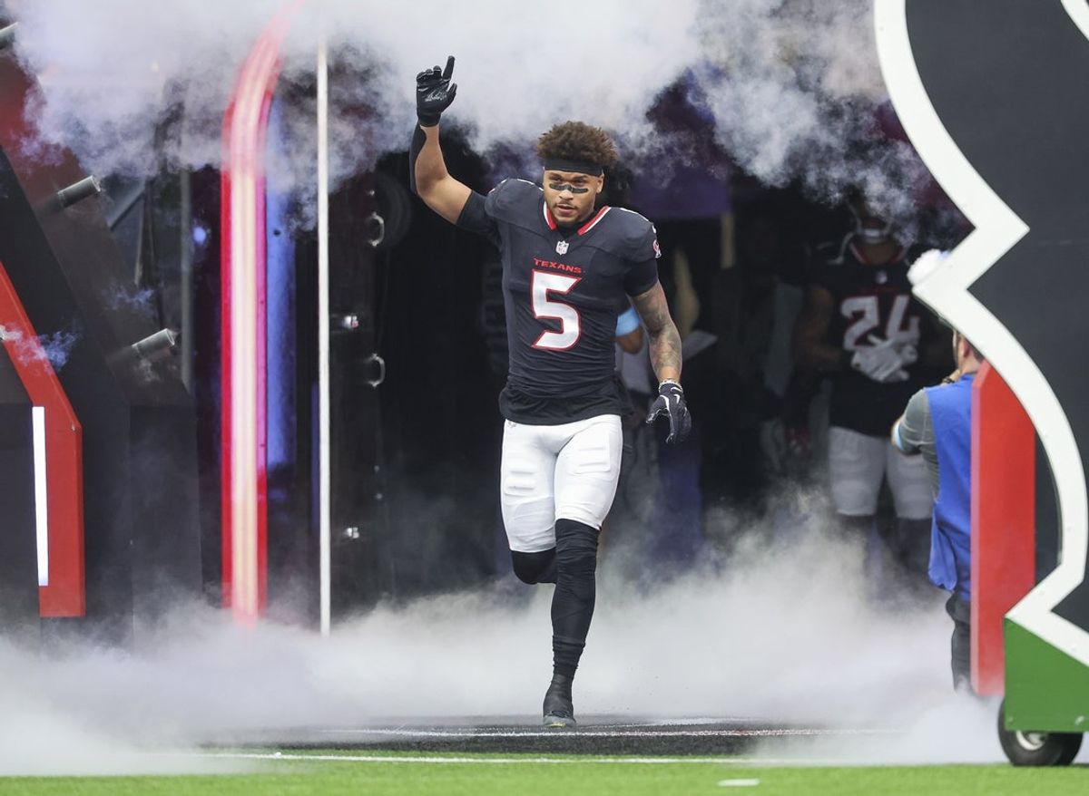 Oct 27, 2024; Houston, Texas, USA; Houston Texans safety Jalen Pitre (5) runs onto the field before the game against the Indianapolis Colts at NRG Stadium. Mandatory Credit: Troy Taormina-Imagn Images