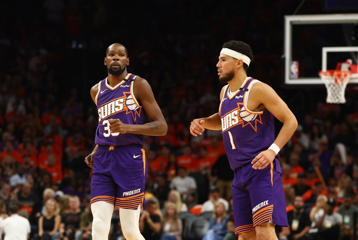 Oct 26, 2024; Phoenix, Arizona, USA; Phoenix Suns forward Kevin Durant (35) and guard Devin Booker (1) against the Dallas Mavericks in the home opener at Footprint Center. Mandatory Credit: Mark J. Rebilas-Imagn Images