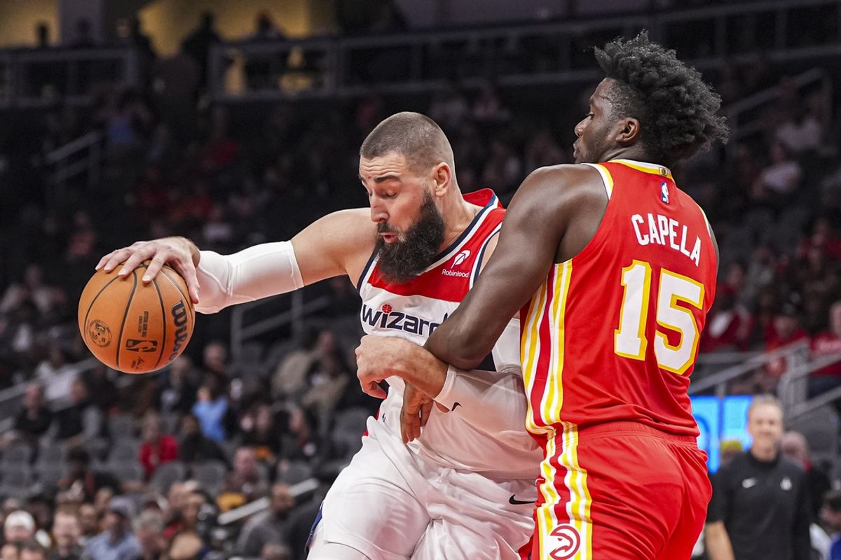 Oct 28, 2024; Atlanta, Georgia, USA; Washington Wizards center Jonas Valanciunas (17) is defended by Atlanta Hawks center Clint Capela (15) during the first half at State Farm Arena. Mandatory Credit: Dale Zanine-Imagn Images