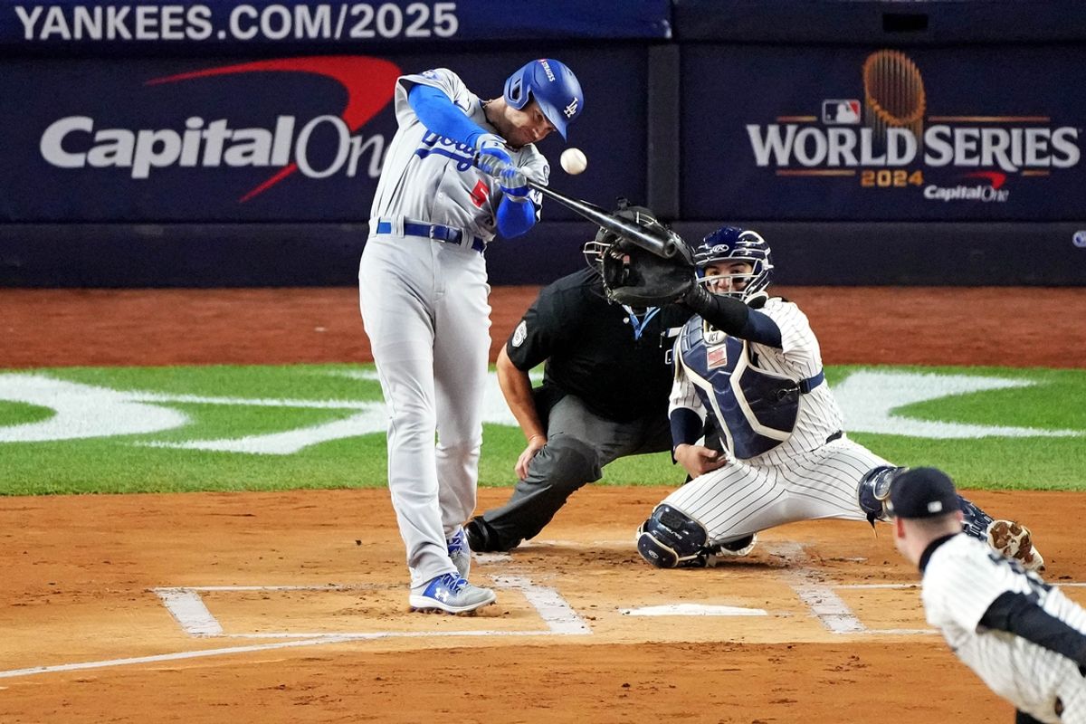 Oct 28, 2024; New York, New York, USA; Los Angeles Dodgers first baseman Freddie Freeman (5) hits a two run home run during the first inning against the New York Yankees in game three of the 2024 MLB World Series at Yankee Stadium. Mandatory Credit: Robert Deutsch-Imagn Images