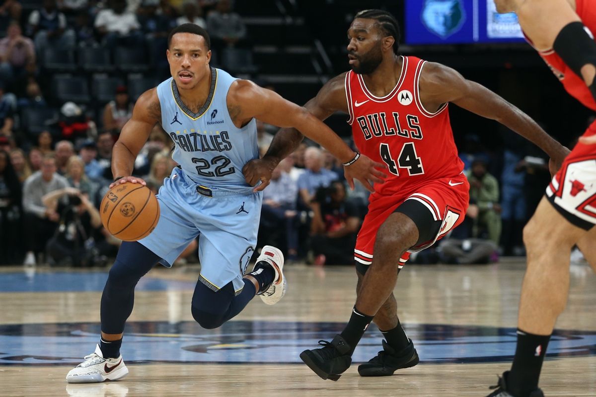 Oct 28, 2024; Memphis, Tennessee, USA; Memphis Grizzlies guard Desmond Bane (22) dribbles as Chicago Bulls forward Patrick Williams (44) defends during the first half at FedExForum. Mandatory Credit: Petre Thomas-Imagn Images