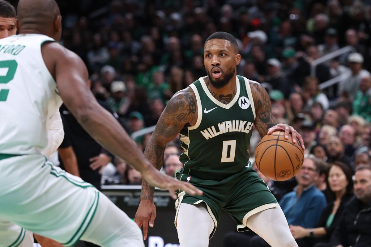 Oct 28, 2024; Boston, Massachusetts, USA; Milwaukee Bucks guard Damian Lillard (0) dribbles down the court during the first half against the Boston Celtics at TD Garden. Mandatory Credit: Paul Rutherford-Imagn Images