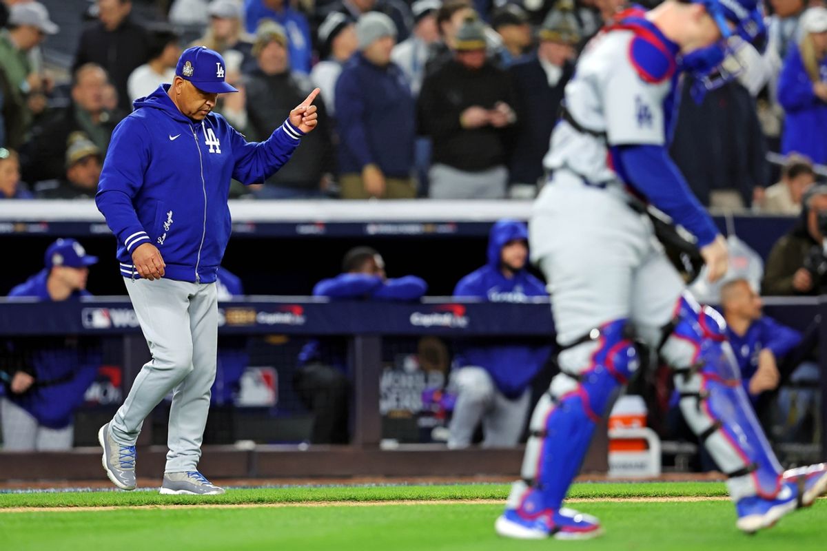 Oct 28, 2024; New York, New York, USA; Los Angeles Dodgers manager Dave Roberts (30) signals to the bull pen for a pitching change during the sixth inning against the New York Yankees in game three of the 2024 MLB World Series at Yankee Stadium. Mandatory Credit: Brad Penner-Imagn Images