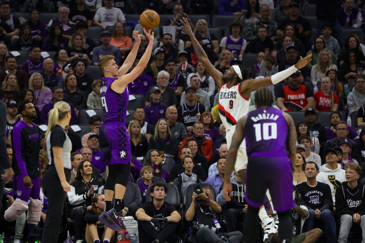 Oct 28, 2024; Sacramento, California, USA; Sacramento Kings guard Kevin Huerter (9) shoots the ball against Portland Trail Blazers forward Jerami Grant (9) during the first quarter at Golden 1 Center. Mandatory Credit: Sergio Estrada-Imagn Images