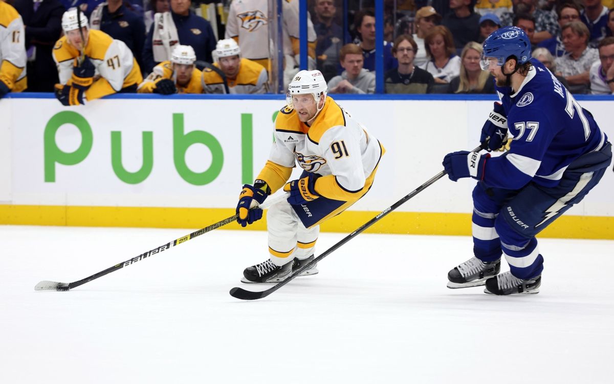 Oct 28, 2024; Tampa, Florida, USA; Nashville Predators center Steven Stamkos (91) skates with the puck as Tampa Bay Lightning defenseman Victor Hedman (77) defends during overtime at Amalie Arena. Mandatory Credit: Kim Klement Neitzel-Imagn Images