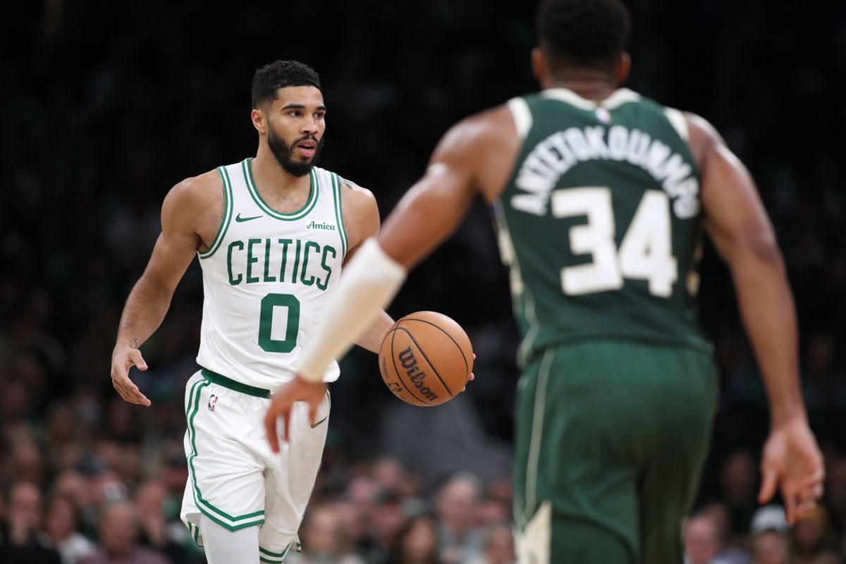 Oct 28, 2024; Boston, Massachusetts, USA; Boston Celtics forward Jayson Tatum (0) dribbles down the court defended by Milwaukee Bucks forward Giannis Antetokounmpo (34) during the second half at TD Garden. Mandatory Credit: Paul Rutherford-Imagn Images