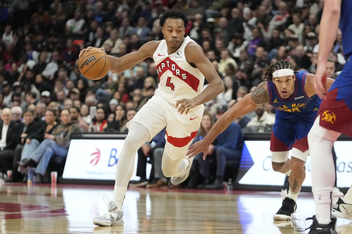 Oct 28, 2024; Toronto, Ontario, CAN; Toronto Raptors forward Scottie Barnes (4) drives to the net against Denver Nuggets forward Aaron Gordon (32) during the second half at Scotiabank Arena. Mandatory Credit: John E. Sokolowski-Imagn Images