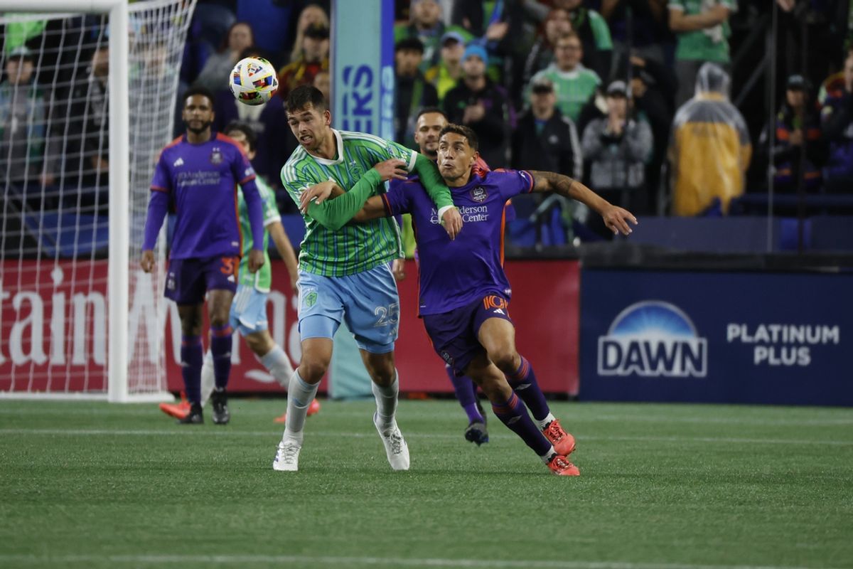 Oct 28, 2024; Seattle, Washington, USA; Seattle Sounders FC defender Jackson Ragen (25) fouls Houston Dynamo FC forward Ezequiel Ponce (10) in the second half in a 2024 MLS Cup Playoffs Round One match at Lumen Field. Mandatory Credit: Joe Nicholson-Imagn Images