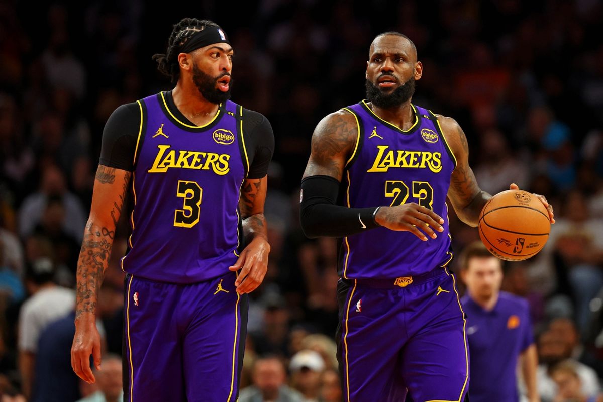 Oct 28, 2024; Phoenix, Arizona, USA; Los Angeles Lakers forward Anthony Davis (3) and forward LeBron James (23) walks to the bench during the first half against the Phoenix Suns at Footprint Center. Mandatory Credit: Mark J. Rebilas-Imagn Images