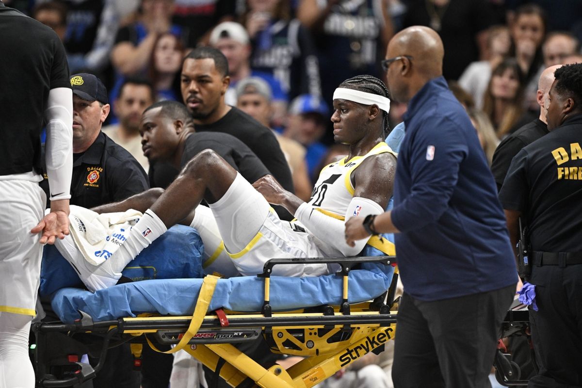 Oct 28, 2024; Dallas, Texas, USA; Utah Jazz forward Taylor Hendricks (0) is taken off the court after suffering a leg injury during the second half against the Dallas Mavericks at the American Airlines Center. Mandatory Credit: Jerome Miron-Imagn Images