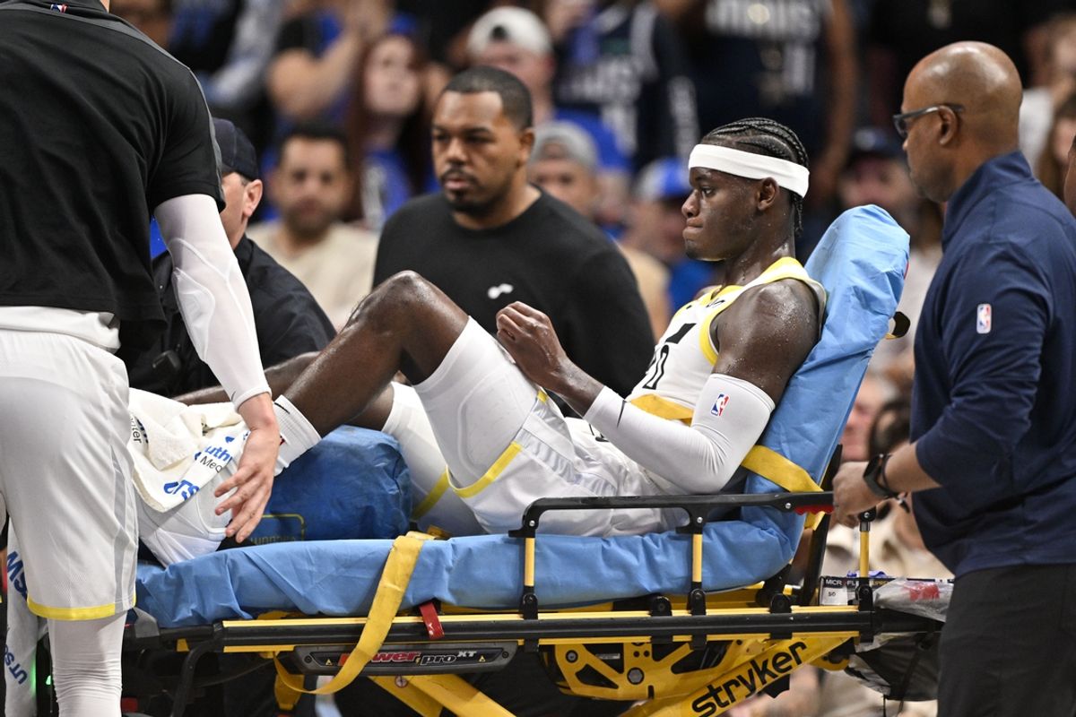 Oct 28, 2024; Dallas, Texas, USA; Utah Jazz forward Taylor Hendricks (0) is taken off the court after suffering a leg injury during the second half against the Dallas Mavericks at the American Airlines Center. Mandatory Credit: Jerome Miron-Imagn Images