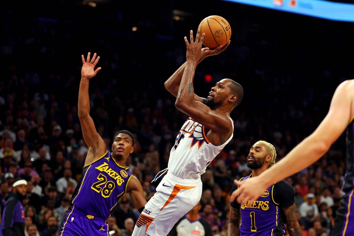 Oct 28, 2024; Phoenix, Arizona, USA; Phoenix Suns forward Kevin Durant (35) shoots the ball against Los Angeles Lakers forward Rui Hachimura (28) during the second half at Footprint Center. Mandatory Credit: Mark J. Rebilas-Imagn Images