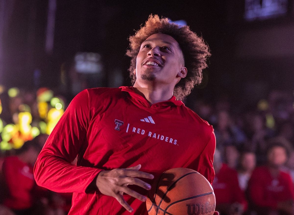 Darrion Williams competes in a challenge during the Texas Tech basketball block party, Monday, October 28, 2024, on Broadway.