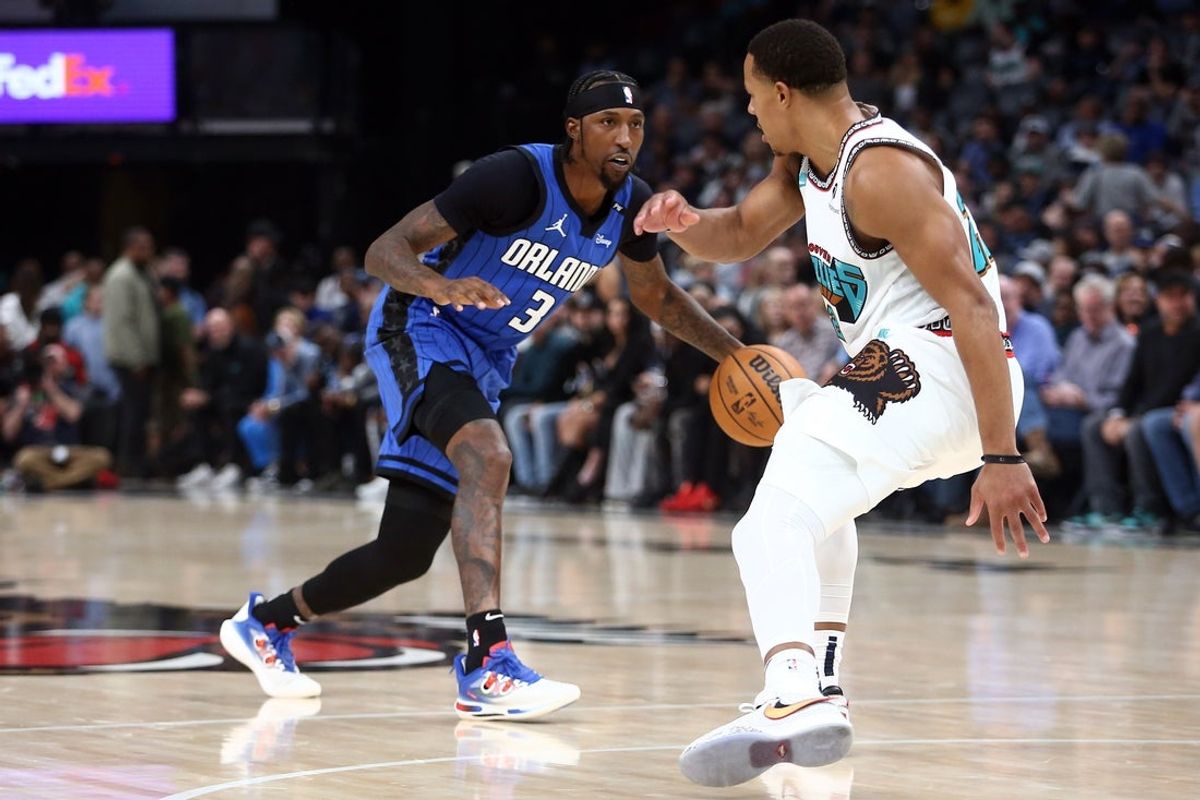 Oct 26, 2024; Memphis, Tennessee, USA; Orlando Magic guard Kentavious Caldwell-Pope (3) shoots as Memphis Grizzlies guard Desmond Bane (22) defends during the first half at FedExForum. Mandatory Credit: Petre Thomas-Imagn Images
