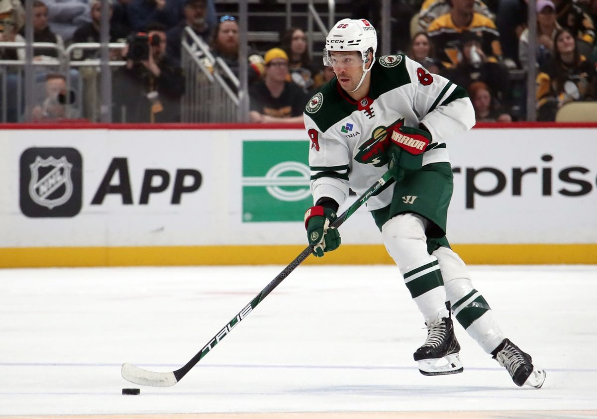 Oct 29, 2024; Pittsburgh, Pennsylvania, USA;  Minnesota Wild center Frederick Gaudreau (89) skates up ice with the puck against the Pittsburgh Penguins during the second period at PPG Paints Arena. Mandatory Credit: Charles LeClaire-Imagn Images