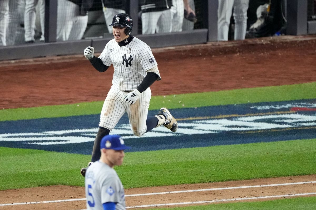 Oct 29, 2024; Bronx, New York, USA; New York Yankees shortstop Anthony Volpe (11) reacts after hitting a grand slam against the Los Angeles Dodgers in the third inning during game four of the 2024 MLB World Series at Yankee Stadium. Mandatory Credit: Robert Deutsch-Imagn Images