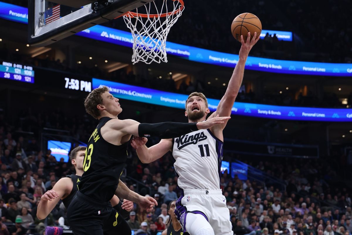 Oct 29, 2024; Salt Lake City, Utah, USA; Sacramento Kings forward Domantas Sabonis (11) shoots the ball over Utah Jazz forward Lauri Markkanen (23) during the second quarter at Delta Center. Mandatory Credit: Rob Gray-Imagn Images